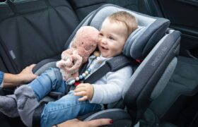 Position booster securely, fasten child, route seat belt correctly following manufacturer's instructions and local laws.